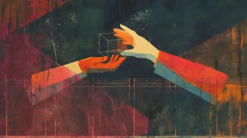 One hand passing a shape to another hand over a fence.